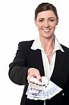 Smiling Corporate Woman Showing British Pound Stock Photo