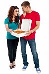 Smiling Couple Holding Pizza Box Stock Photo