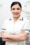 Smiling Dentist Posing Confidently Stock Photo