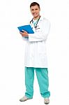 Smiling Doctor Holding Clipboard Stock Photo