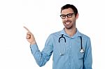 Smiling Doctor Pointing Copy Space Area Stock Photo