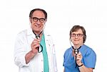 Smiling Doctors Holding Stethoscope Stock Photo