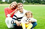 Smiling Family In Outdoors Stock Photo