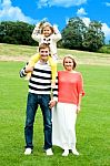 Smiling Family In Outdoors Stock Photo