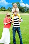 Smiling Family In Outdoors Stock Photo