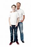 Smiling Father And Son Posting Together Stock Photo