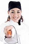 Smiling Female Chef Holding Knife Stock Photo