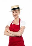 Smiling Female Chef Wearing Hat Stock Photo