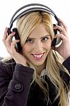 Smiling Female Listening Music Stock Photo