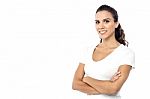 Smiling Female Posing With Arms Crossed Stock Photo