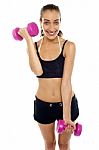 Smiling Fit Woman Working Out With Dumbbells Stock Photo