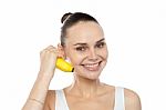 Smiling girl holding banana Stock Photo