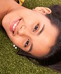 Smiling Girl Relaxing In Garden Stock Photo