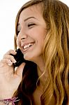 Smiling Girl Talking Over Cellphone Stock Photo