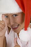 Smiling Girl Wearing Christmas Hat Stock Photo