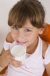 Smiling Girl With Glass Of Milk Stock Photo