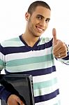 Smiling Guy Holding Notebook Showing Thumbs Up Stock Photo