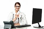 Smiling Lady Doctor Holding Pack Of Medicine Stock Photo