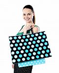 Smiling Lady Holding Shopping Bag Stock Photo