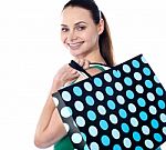 Smiling Lady Holding Shopping Bag Stock Photo