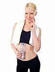 Smiling lady Holding Water Bottle Stock Photo