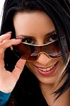 Smiling Lady Removing Sunglasses Stock Photo