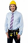 Smiling Male Architect Wearing Tool Belt Stock Photo