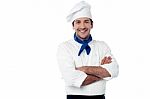 Smiling Male Chef Posing With Arms Crossed Stock Photo