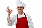 Smiling Male Chef Showing Ok Sign Stock Photo