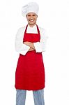 Smiling Male Chef With Arms Crossed Stock Photo