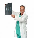 Smiling Male Doctor Holding X Ray Stock Photo