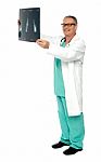 Smiling Male Doctor Holding X Ray Stock Photo