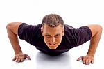 Smiling Male Doing Push Ups Stock Photo