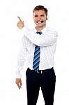 Smiling Male Executive Pointing Stock Photo