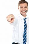 Smiling Male Executive Pointing Stock Photo