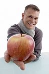 Smiling Male Showing Apple Stock Photo