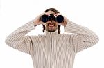 Smiling  Male Watching Through Binocular Stock Photo