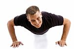 smiling Man Doing Push Ups Stock Photo