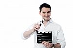 Smiling Man Holding A Movie Clap Isolated On White Stock Photo