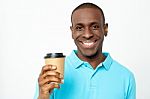 Smiling Man Holding Cold Beverage Stock Photo