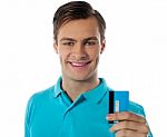 Smiling Man Holding Credit Card Stock Photo