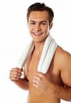 Smiling Man Holding Gym Towel Stock Photo