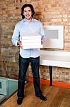 Smiling Man Holding Pizza Boxes Stock Photo