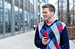 Smiling Man Listens Music In A Street Stock Photo