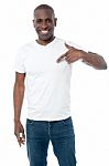 Smiling Man Pointing At Blank White T-shirt Stock Photo