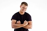 Smiling Man Showing His Muscles Stock Photo