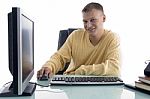 Smiling Man Working On Computer Stock Photo