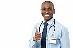 Smiling Medical Doctor Showing Thumbs Up Stock Photo