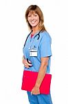 Smiling Medical Nurse With Clipboard Stock Photo