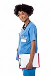 Smiling Medical Professional Holding Blank Clipboard Stock Photo